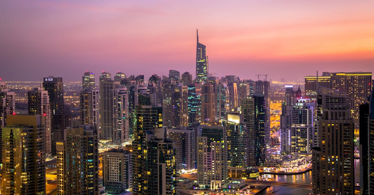Captivating view of Dubai's skyline at dusk with vibrant city lights and skyscrapers.