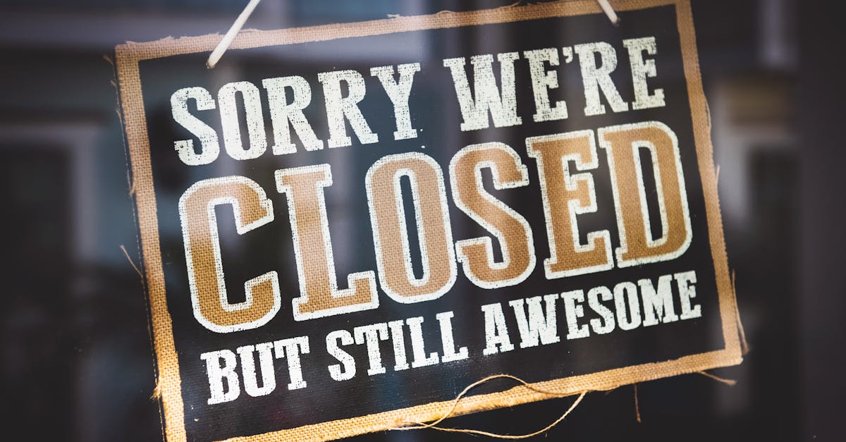 A playful closed sign on a shop door reading 'Sorry We're Closed But Still Awesome'.