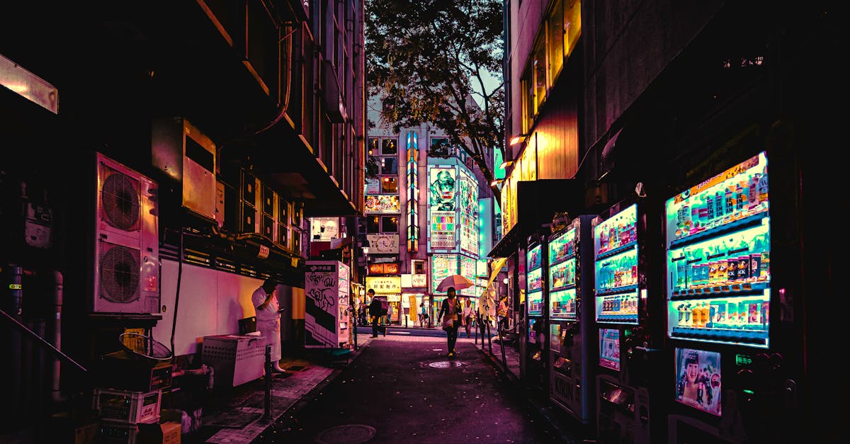 Explore a neon-lit alleyway in Tokyo, showcasing vibrant city life and bustling urban vibes.