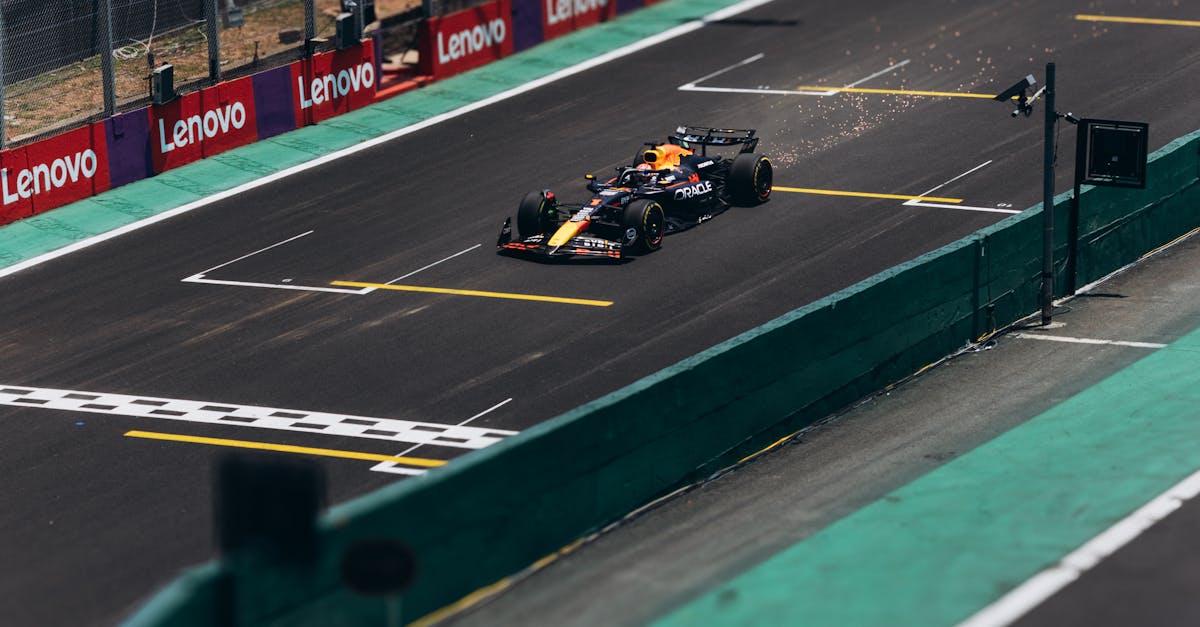 A Formula 1 car speeds down the track during a race, showcasing high performance.